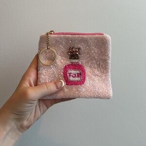 Elegant Pink Beaded Wristlet with Perfume Design